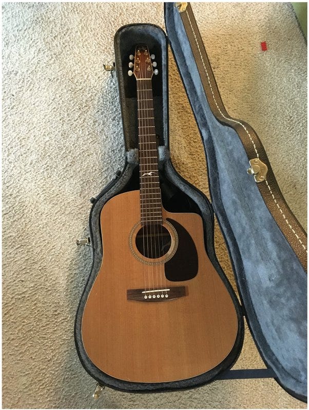 A Seagull Artist Series acoustic guitar