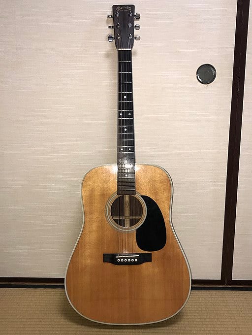 a Martin D-28 acoustic guitar