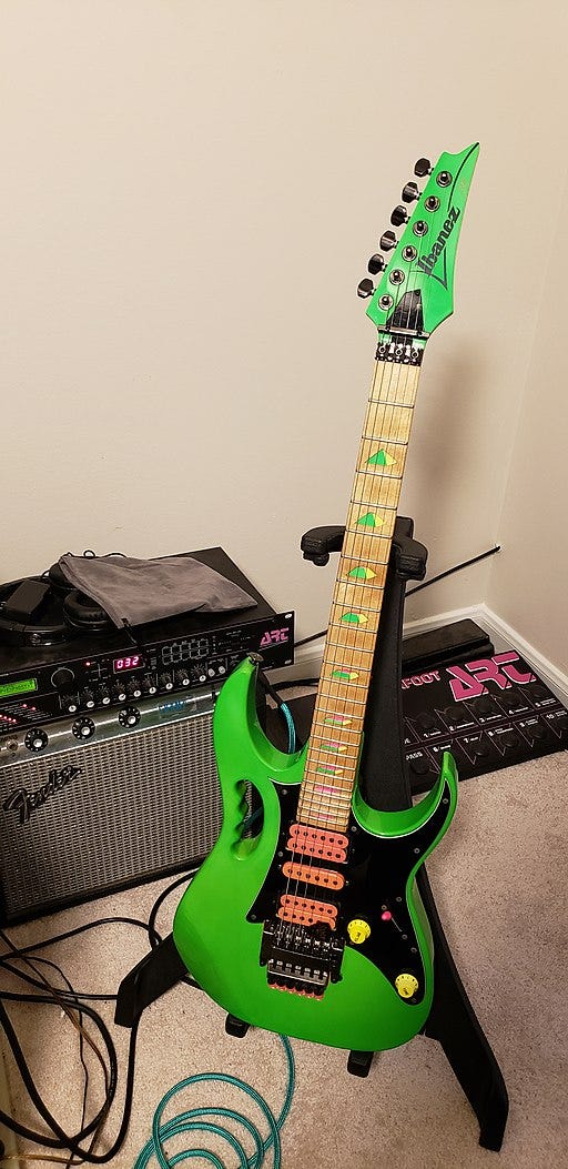 An Ibanez JEM electric guitar