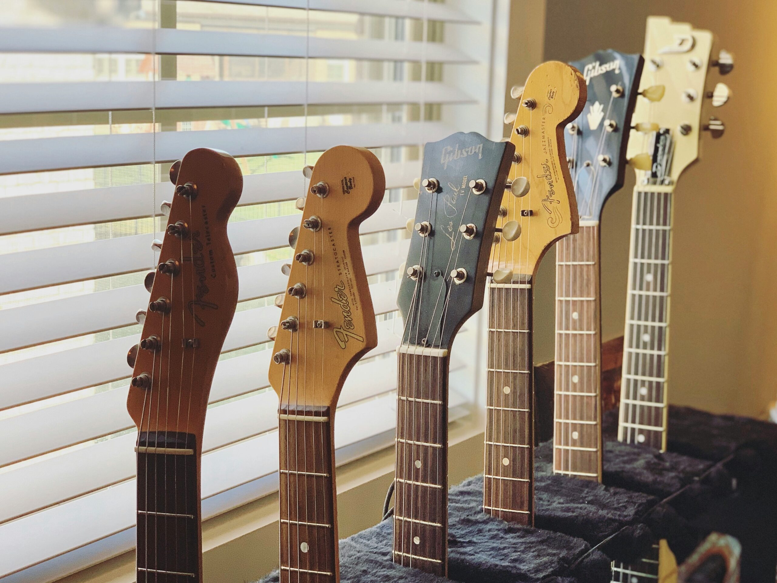 multiple guitars on a rack